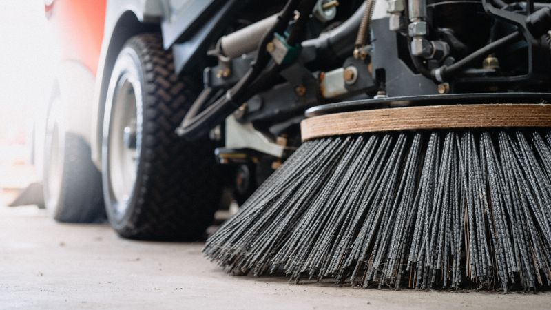 Road surface cleaning brushes